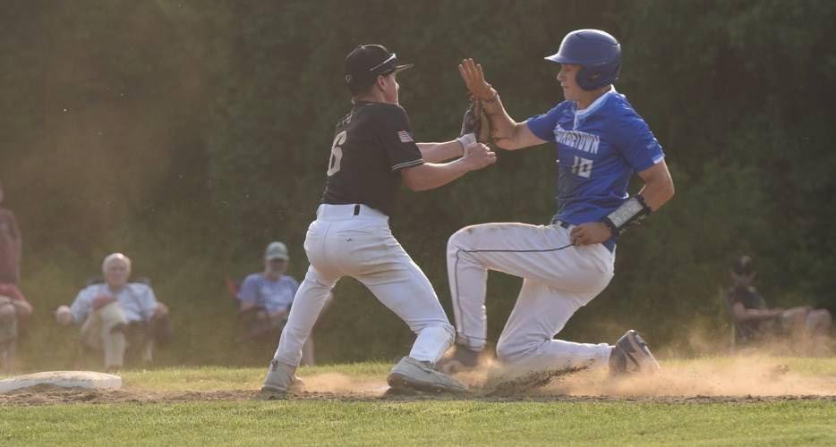 Pioneer’s Jackson Campbell, left, applies a tag on a Georgetown base runner during the Panthers’ extra innings victory over the Royals in the MIAA Division 5 Round of 16 on Thursday night in Northfield.