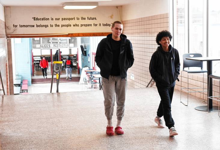 Seniors Colby Goodwin and Andru Pope walk down the hall between classes at Athol High School on Friday.