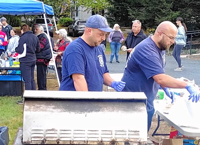Royalston Public Works Director Jaret Thiem (left) and his brother Jeff served up hot dogs and hamburgers at Royalston's National Night Out event.