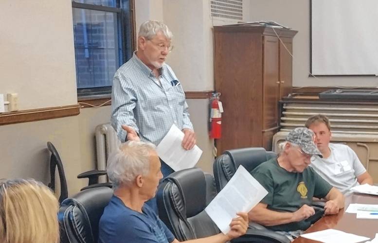 Mike Magee of Orange (standing) met recently with Athol's Conservation Commission to urge members to opposed S 447, a bill filed by state Sen. Jo Comerford, which he says could have a negative impact on the Quabbin Reservoir.