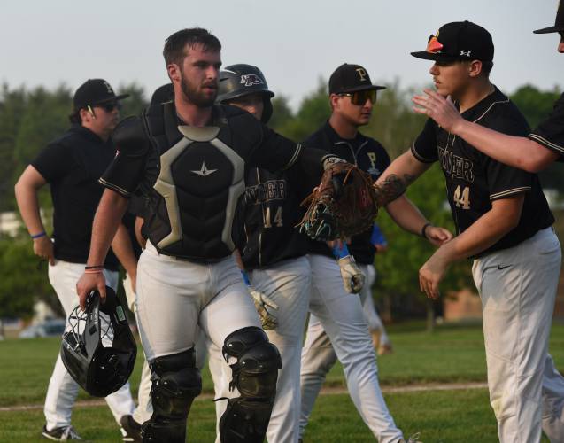 Pioneer’s Braeden Tsipenyuk high fives his teammates during the Panthers’ extra innings victory over Georgetown in the MIAA Division 5 Round of 16 on Thursday night in Northfield.