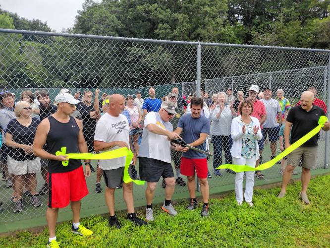 On Saturday, Aug. 17, the ribbon was cut to open the resurfaced pickleball courts at Silver Lake Park. (From left) Matt King, Charlie Frost, Tim Burgess, and Todd Martinelli – all of the Silver Lake Pickleball Association – and Athol-Orange Rotary Club President Lynn Goodnow and President-Elect Bill Kessler.