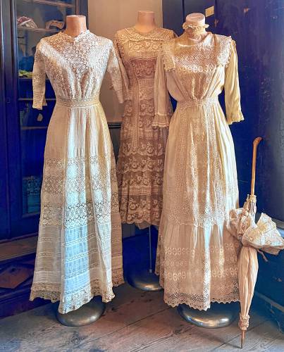 Lace dresses from the past which are part of the Athol Historical Society’s collection are displayed on mannequins.