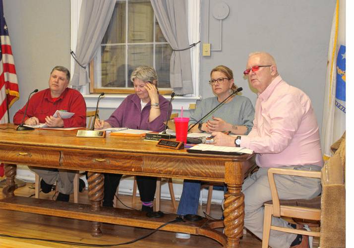 From left, Orange Selectboard member Mike Bates, member Jane Peirce, Vice Chair Julie Davis and Chair Tom Smith listen to an attendee speak at Wednesday’s meeting in Orange Town Hall. From left, Orange Selectboard member Mike Bates, member Jane Peirce, Vice Chair Julie Davis and Chair Tom Smith listen to an attendee speak at Wednesday’s meeting in Orange Town Hall.