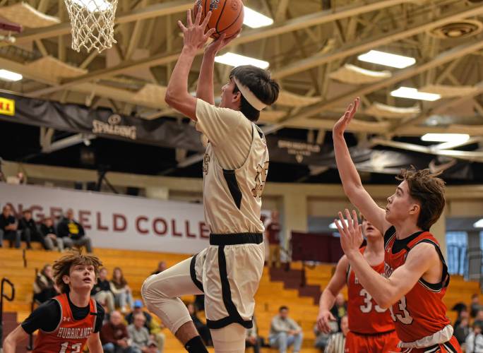 Pioneer’s Alex McClelland (15) drives to the basket against Hoosac Valley during the Panthers’ 68-53 loss in the Hoophall Classic at Springfield College’s Blake Arena on Thursday.