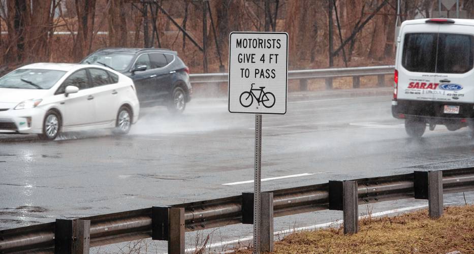 Signs reminding drivers to provide space for bikers on Route 9 in Hadley just over the Coolidge Bridge.  A year after MassBike played a key role in passage of a law aimed at making roads safer for “vulnerable users” — bicyclists, pedestrians and more — the coalition is again pushing for more law changes designed to add further protection for these users.  