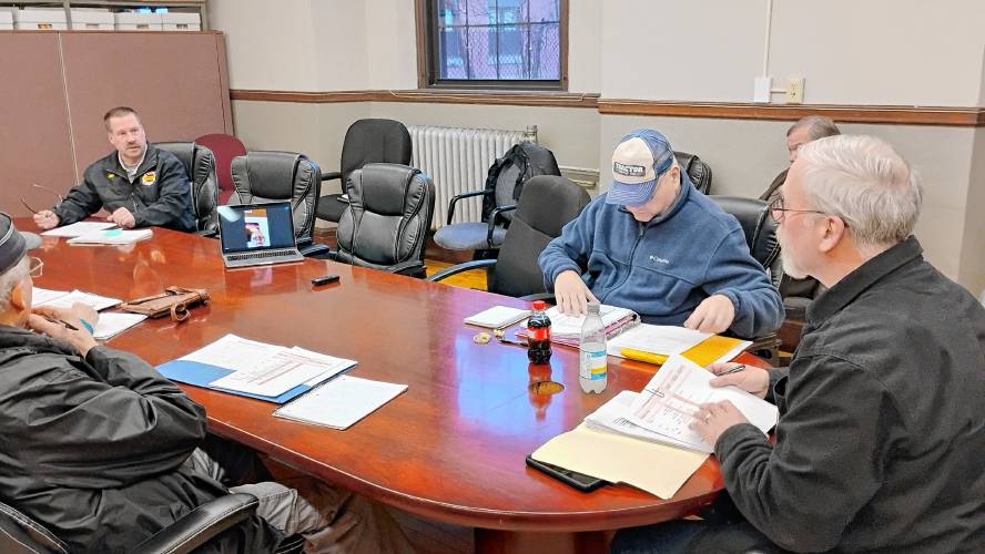 Athol Fire Chief Jeff Parker (far left) speaks with the town's Capital Program Committee about his department's need for a new tanker. Committee Chair Jim Smith is at far right. Athol Fire Chief Jeff Parker (far left) speaks with the town's Capital Program Committee about his department's need for a new tanker. Committee Chair Jim Smith is at far right.