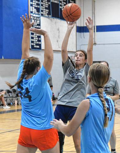 Mahar’s Taylor Paluk shoot over Franklin Tech defenders during semifinal round action in the Franklin Tech Girls Summer Basketball League in Turners Falls on Tuesday night.