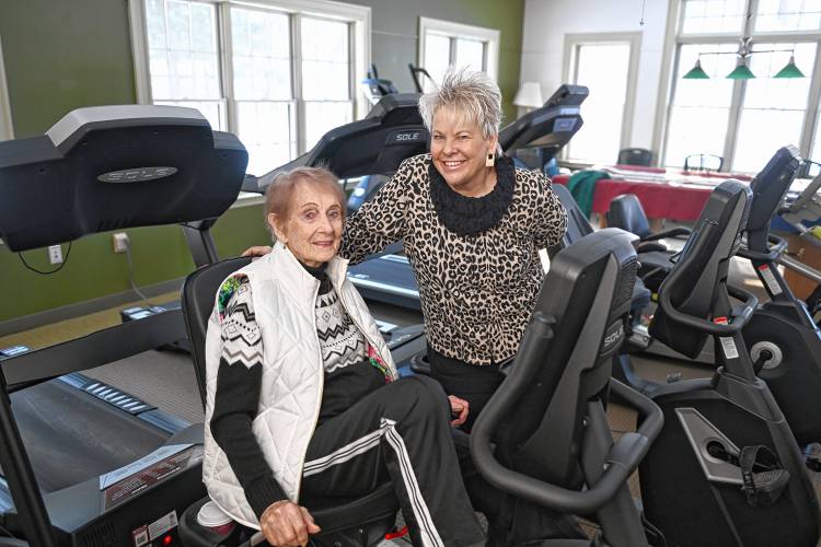 Director of the Erving Senior and Community Center Paula Betters, right,  with 96-year-old Janis Lefebre in the exercise room at the Senior Center. 