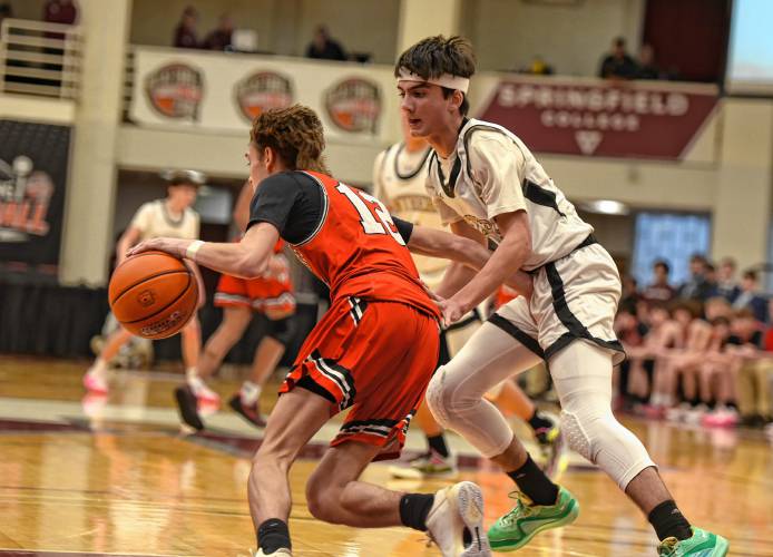 Pioneer’s Alex McClelland (15) defends Hoosac Valley’s Adan Wicks (12) during the Panthers’ 68-53 loss in the Hoophall Classic at Springfield College’s Blake Arena on Thursday.