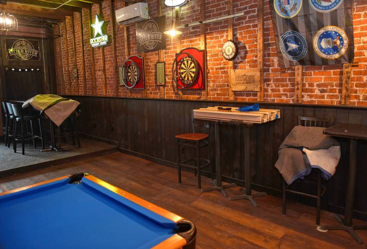 Darts and three pool tables at the Otter River Pub in Templeton.