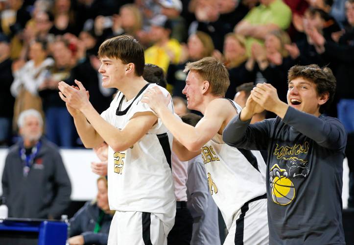 The Pioneer sideline celebrates after their 49-28 win over Hopedale for the MIAA Div. 5 state championship Saturday at the Tsongas Center in Lowell. 