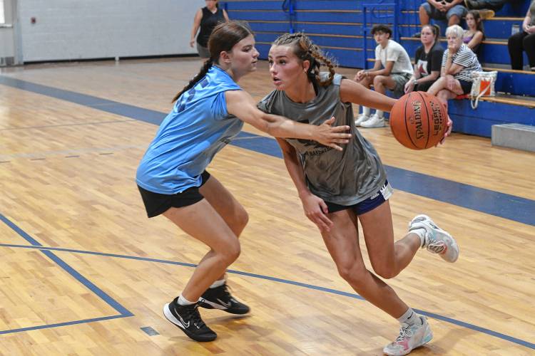 Mahar’s Nevaeh Scribner, right, dribbles past Franklin Tech’s Madyson Lynde during semifinal round action in the Franklin Tech Girls Summer Basketball League in Turners Falls on Tuesday night.
