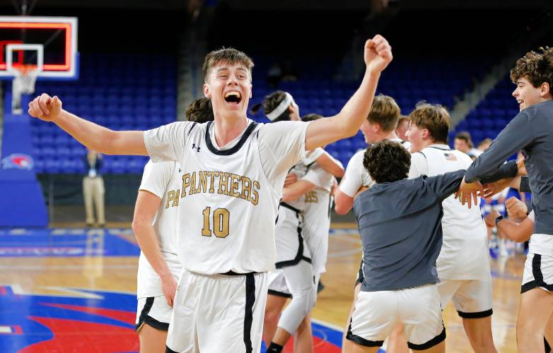 Pioneer’s Brayden Thayer celebrates after their 49-28 win over Hopedale for the MIAA Div. 5 state championship Saturday at the Tsongas Center in Lowell. 