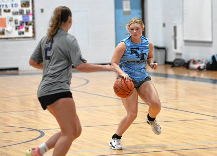 Franklin Tech’s Cordelia Guerin dribbles while defended by Mahar’s Hayden Comeau during semifinal round action in the Franklin Tech Girls Summer Basketball League in Turners Falls on Tuesday night.