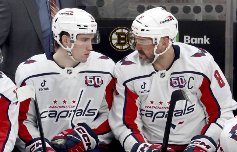 Washington Capitals newly acquired right wing Ryan Leonard, left, of Amherst, and left wing Alex Ovechkin, right, chat during the second period against the Boston Bruins, Tuesday in Boston.