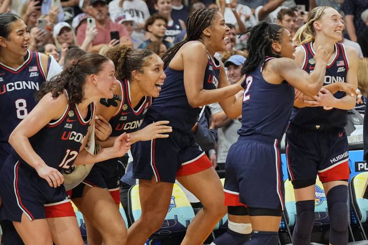 UConn players react late in the second half of the national championship game against South Carolina at the Final Four of the women’s NCAA Tournament on Sunday in Tampa, Fla. 
