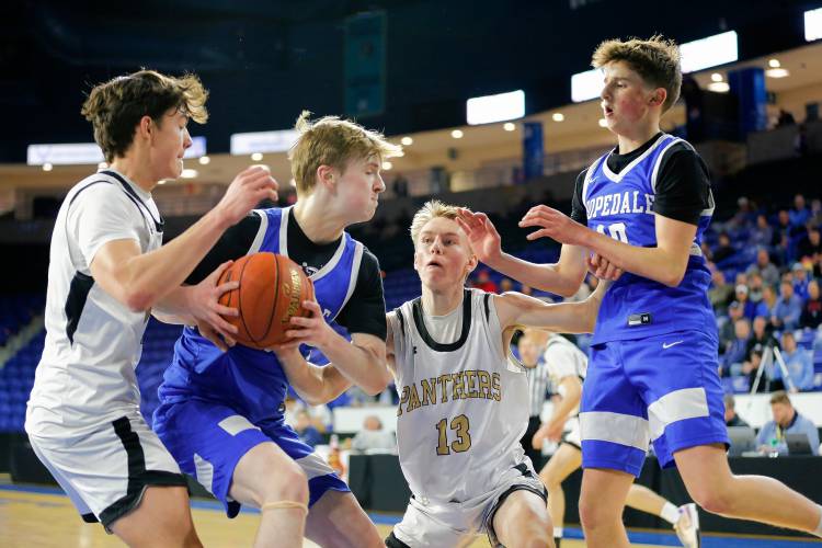 Pioneer’s Kurt Redeker (3), left, and Judah Glenn (13) fight for a rebound against Hopedale’s Danny Carroll (33) and JJ Douglas (10) in the second quarter of the MIAA Div. 5 state championship Saturday at the Tsongas Center in Lowell. 