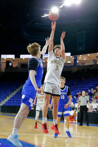 Pioneer’s Kurt Redeker (3) puts up a shot over Hopedale’s Danny Carroll (33) in the second quarter of the MIAA Div. 5 state championship Saturday at the Tsongas Center in Lowell. 