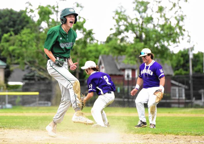 Greenfield’s Caleb Thomas celebrates after reaching third base in the third inning of his team’s 7-3 win over Bourne in the MIAA Division 5 quarterfinal round on Saturday.