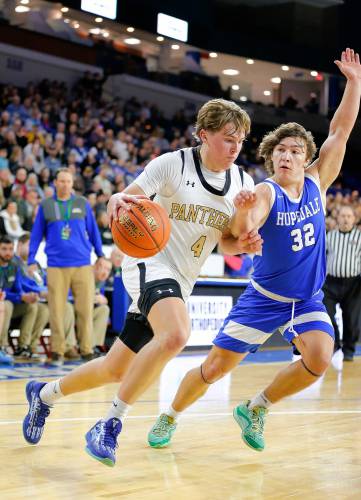 Pioneer’s Jackson Glazier (4) drives the ball against Hopedale defender Brayden Lewis (32) in the second quarter of the MIAA Div. 5 state championship Saturday at the Tsongas Center in Lowell. 